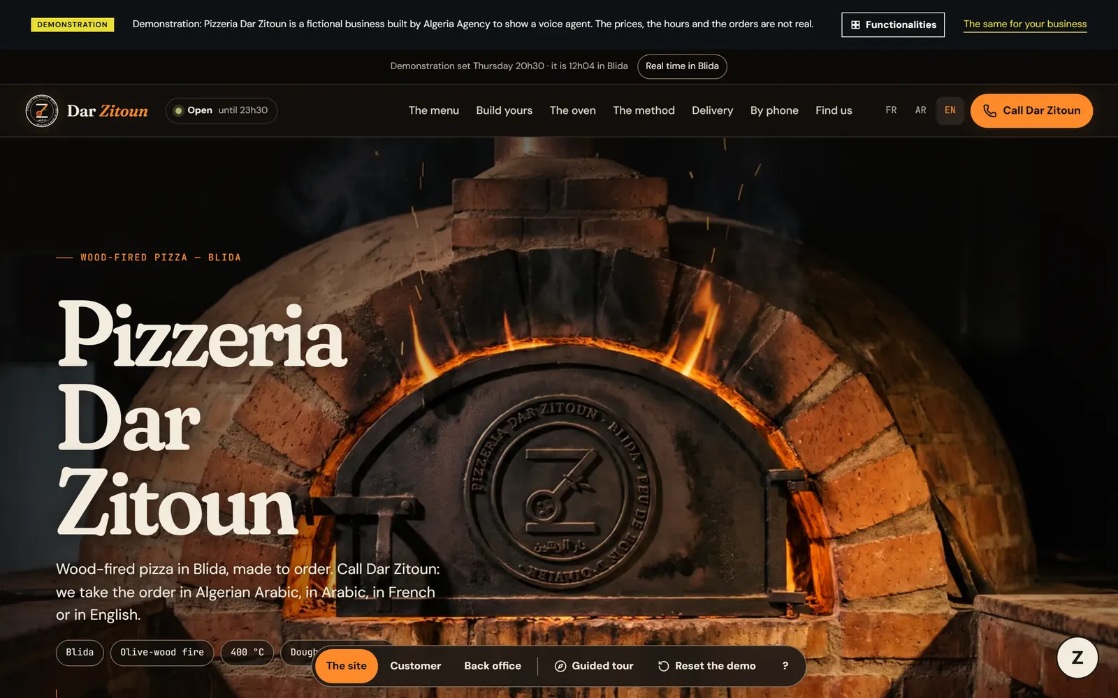 Pizzeria Dar Zitoun homepage with a lit wood-fired oven, the title and the call button.